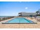 Outdoor swimming pool and lounge chairs overlooking the ocean at 1239 Ocean Shore Blvd # 3C3, Ormond Beach, FL 32176