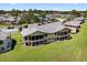 Aerial view of the townhome showcasing the beautiful grounds and surrounding community at 133 Blue Heron Dr # D, Daytona Beach, FL 32119