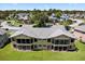 Aerial view of a multi-Gathering property with a meticulously maintained lawn at 133 Blue Heron Dr # D, Daytona Beach, FL 32119