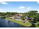 Stunning aerial of community building with lush landscaping and waterfront views at 133 Blue Heron Dr # D, Daytona Beach, FL 32119