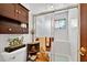 This bathroom features a glass-enclosed shower, decorative shelving, and clean white tile at 133 Blue Heron Dr # D, Daytona Beach, FL 32119