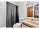Bright bathroom with a shower and bath combination, vanity and neutral tile at 133 Blue Heron Dr # D, Daytona Beach, FL 32119