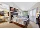 Tranquil bedroom with a large bed, natural light, and access to an ensuite bathroom at 133 Blue Heron Dr # D, Daytona Beach, FL 32119