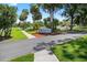 Entrance to the Pelican Bay Country Club showcasing lush landscaping and welcoming signage at 133 Blue Heron Dr # D, Daytona Beach, FL 32119