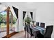 Bright dining room boasts hardwood floors, lots of natural light and seating for six at 133 Blue Heron Dr # D, Daytona Beach, FL 32119