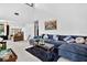 Spacious living room with high ceilings, plush seating, and ample natural light at 133 Blue Heron Dr # D, Daytona Beach, FL 32119