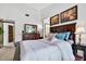 Comfortable main bedroom featuring a king bed, ensuite bathroom, and neutral décor at 133 Blue Heron Dr # D, Daytona Beach, FL 32119