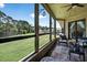 Enjoy the view from this screened porch with outdoor seating at 133 Blue Heron Dr # D, Daytona Beach, FL 32119