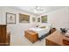 Bedroom with neutral walls, a ceiling fan, two windows, and carpet flooring at 1505 Valencia Ave, Daytona Beach, FL 32117