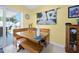 Bright dining area with a cozy banquette and sliding glass doors to the backyard at 1505 Valencia Ave, Daytona Beach, FL 32117
