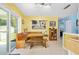 Bright dining area with a cozy banquette and sliding glass doors to the backyard at 1505 Valencia Ave, Daytona Beach, FL 32117