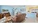 Inviting living room with blue walls, a comfortable recliner, a decorative rug, and stylish decor at 1505 Valencia Ave, Daytona Beach, FL 32117