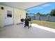 Covered patio with a grill and doorway to the backyard at 1505 Valencia Ave, Daytona Beach, FL 32117