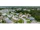 An aerial view showcases a residential neighborhood with well-maintained homes and lush landscaping at 209 Falcon Ave, Edgewater, FL 32141