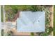 Aerial view of a home's roof, landscaping, driveway and surrounding yard with a focus on the roof's condition at 209 Falcon Ave, Edgewater, FL 32141