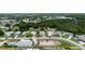 An aerial view highlights a quiet residential street with charming single-Gathering homes and landscaped yards at 209 Falcon Ave, Edgewater, FL 32141