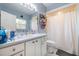 Clean bathroom with a vanity, toilet, and shower-tub combo featuring modern fixtures at 209 Falcon Ave, Edgewater, FL 32141