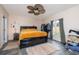 Cozy bedroom with a comfortable bed, rug and natural light from the window at 209 Falcon Ave, Edgewater, FL 32141