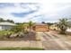 Charming one-story home featuring a well-kept yard, driveway, and neutral exterior paint scheme at 209 Falcon Ave, Edgewater, FL 32141