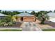 Charming one-story home featuring a well-kept yard, driveway, and neutral exterior paint scheme at 209 Falcon Ave, Edgewater, FL 32141