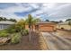 Charming one-story home featuring a well-kept yard, driveway, and neutral exterior paint scheme at 209 Falcon Ave, Edgewater, FL 32141