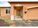 Inviting home exterior with a neutral color scheme, well-manicured landscaping, and a charming front porch at 209 Falcon Ave, Edgewater, FL 32141