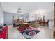 Open-concept living room featuring tile floors, neutral walls and a cozy seating area at 209 Falcon Ave, Edgewater, FL 32141