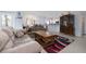 Open-concept living room featuring tile floors, neutral walls and a cozy seating area at 209 Falcon Ave, Edgewater, FL 32141