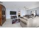 Open-concept living room featuring tile floors, neutral walls and a cozy seating area at 209 Falcon Ave, Edgewater, FL 32141