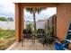 Outdoor patio area with two chairs and view of the backyard at 209 Falcon Ave, Edgewater, FL 32141