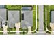 Aerial view of roof, pool and surrounding landscaping at 3048 Borassus Dr, New Smyrna Beach, FL 32168