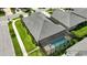 Aerial view of the house with screened-in pool and yard at 3048 Borassus Dr, New Smyrna Beach, FL 32168