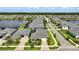 Aerial view of neighborhood with a lake in the background at 3048 Borassus Dr, New Smyrna Beach, FL 32168