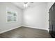 A naturally lit bedroom with gray vinyl floors and white trim at 3048 Borassus Dr, New Smyrna Beach, FL 32168