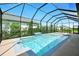A screened in pool with a built in spa offers privacy and relaxation at 3048 Borassus Dr, New Smyrna Beach, FL 32168