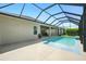 View of the screened-in pool with a covered patio area at 3048 Borassus Dr, New Smyrna Beach, FL 32168