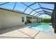 View of the screened-in pool with a covered patio area at 3048 Borassus Dr, New Smyrna Beach, FL 32168