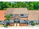 An aerial view of a two-story townhome featuring a red tile roof at 3522 Forest Branch Dr # D, Port Orange, FL 32129