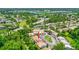 An aerial shot of a residential community with mature trees and a tranquil lake nearby at 3522 Forest Branch Dr # D, Port Orange, FL 32129