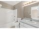 Well-lit bathroom featuring a shower-tub combo and a vanity with a sink at 3522 Forest Branch Dr # D, Port Orange, FL 32129