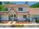 Charming two-story townhome featuring a red tile roof and welcoming front porch at 3522 Forest Branch Dr # D, Port Orange, FL 32129