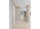 Spacious foyer with tile flooring leading into the open living area at 3522 Forest Branch Dr # D, Port Orange, FL 32129
