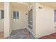 An inviting front porch with tiled flooring and a secure screen door at 3522 Forest Branch Dr # D, Port Orange, FL 32129