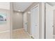 Hallway featuring neutral paint tones, tile flooring, and a closet at 3522 Forest Branch Dr # D, Port Orange, FL 32129