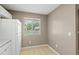 The kitchen features a window that offers natural light and views of the neighborhood at 3522 Forest Branch Dr # D, Port Orange, FL 32129