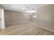 An open living room with ceiling fan, light wood flooring and adjacent dining area at 3522 Forest Branch Dr # D, Port Orange, FL 32129