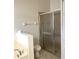 Bathroom with a separate glass enclosed shower and a garden tub with tile surround at 465 Dahoon Holly Dr, Daytona Beach, FL 32117