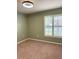 Cozy bedroom with neutral carpet and window with plantation shutters, and fresh paint at 465 Dahoon Holly Dr, Daytona Beach, FL 32117