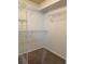 Walk-in closet with wire shelving and neutral carpet, providing ample storage space at 465 Dahoon Holly Dr, Daytona Beach, FL 32117
