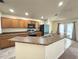 Well-equipped kitchen with stainless steel appliances, breakfast bar, and ample counter space at 465 Dahoon Holly Dr, Daytona Beach, FL 32117